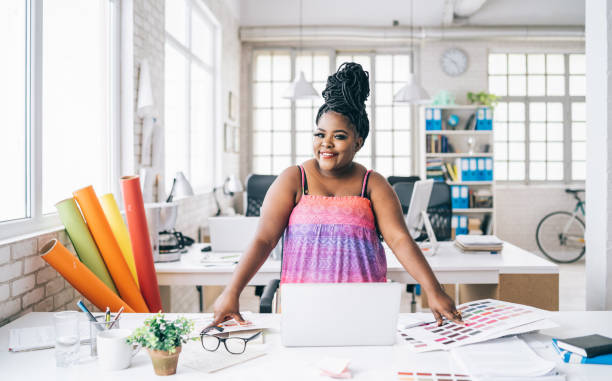 istock Female designer standing in studio 1169301258