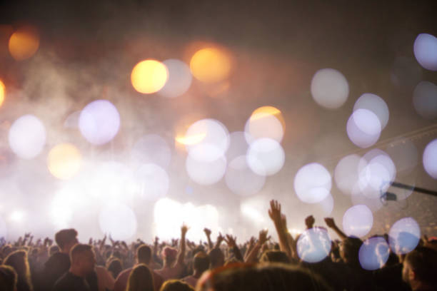 istock Crowd at summer festival blurred background 1169302542