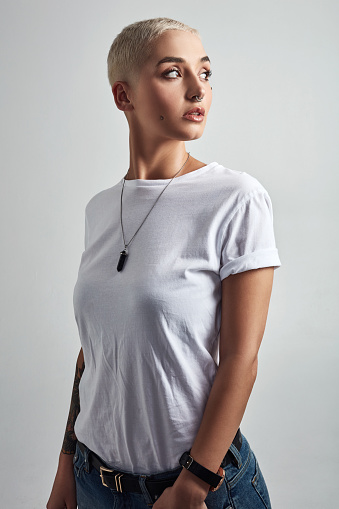 Shot of an attractive and stylish young woman posing against a grey background