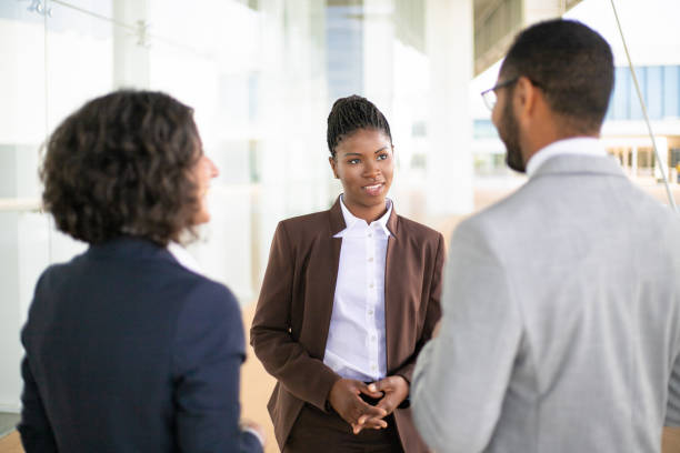 istock Young female manager meeting partners 1169305846