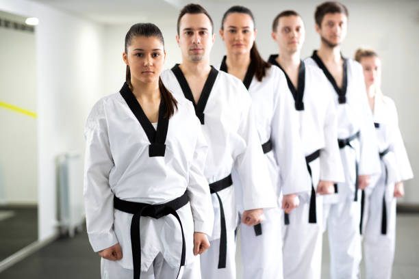 istock Group of lined up martial artists 1169306111