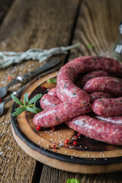 istock Raw homemade sausages with spices 1169308145