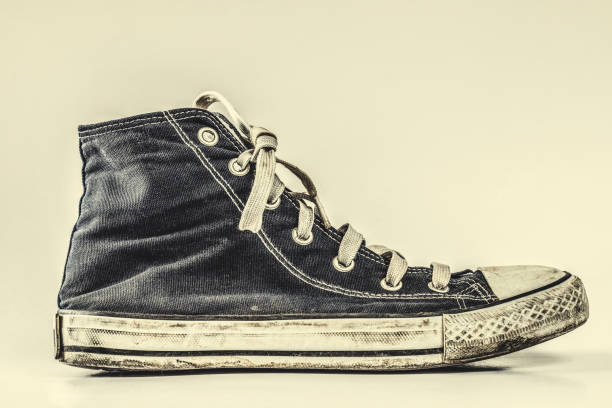 istock Blue canvas sport shoe isolated on background 1169308263