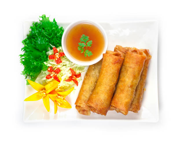 Vegetables Spring Roll deep fried Thai food fusion with Chinese style decorate with vegetables and sweet chili sauce top view stock photo