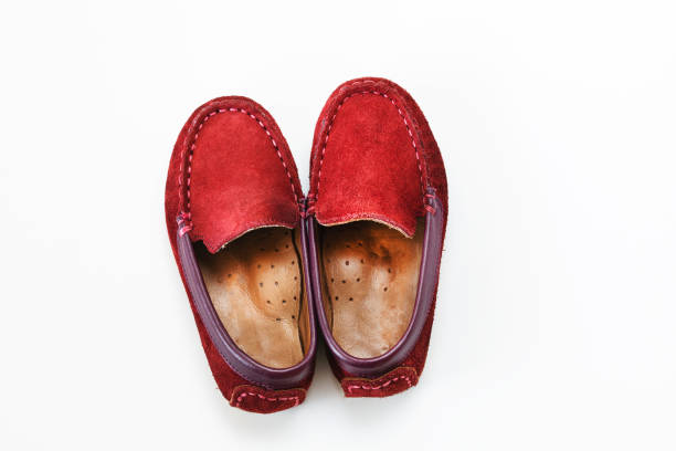 istock Child shoes on a background with space for text. Top view 1169309942