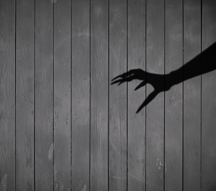 witch's hand shadow, black halloween background