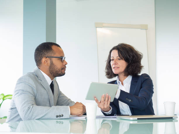 istock Serious female mentor training male intern 1169311566
