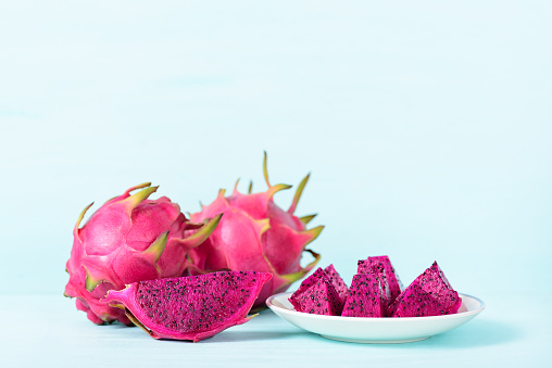 Red dragon fruit or pitaya on color background, tropical fruit