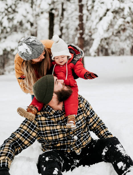istock Let's cover up dad with snow 1169314981