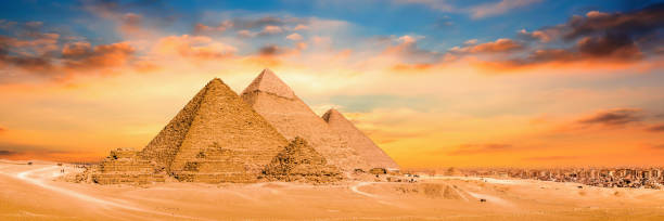 Great Pyramids of Giza, Egypt Panorama of the Great Pyramids of Giza at sunset kheops pyramid photos stock pictures, royalty-free photos & images