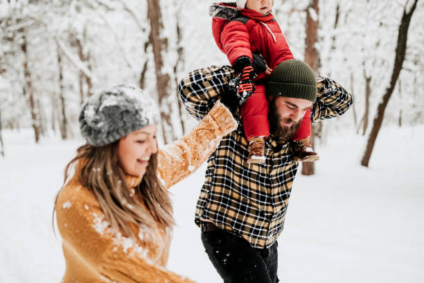 istock Let's cover up dad with snow 1169316436