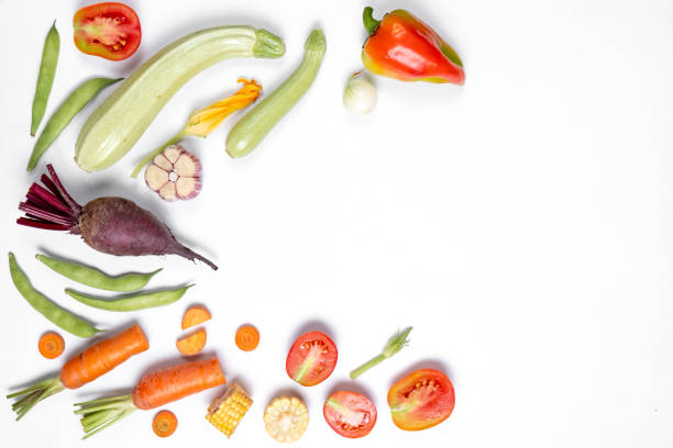 istock Pattern made of haricot, tomatoes, pepper, corn, onion, red beet, carrot, zucchinion white background . Flat lay, top view, copy space. Healthy eating concept. 1169316518