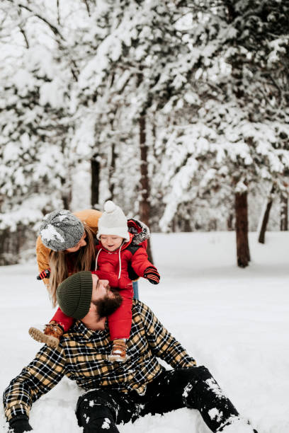 istock Let's cover up dad with snow 1169316739