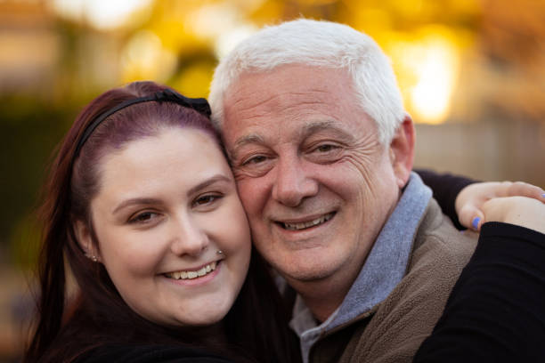 istock Father and daughter share a hug 1169319309