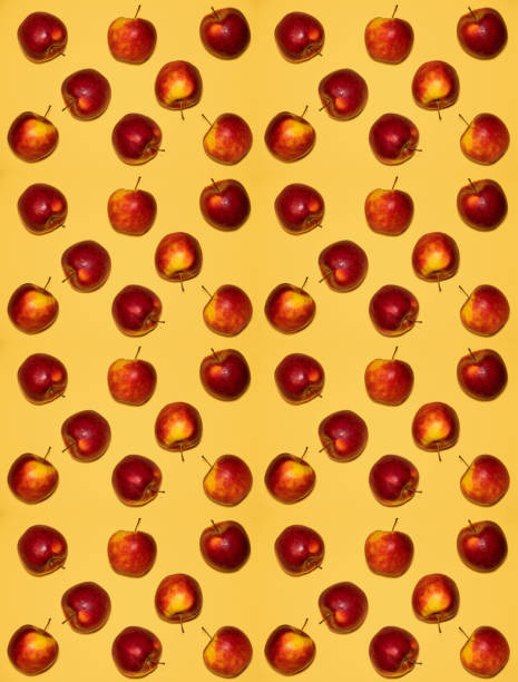istock ripe red apples lie on a yellow 1169320335