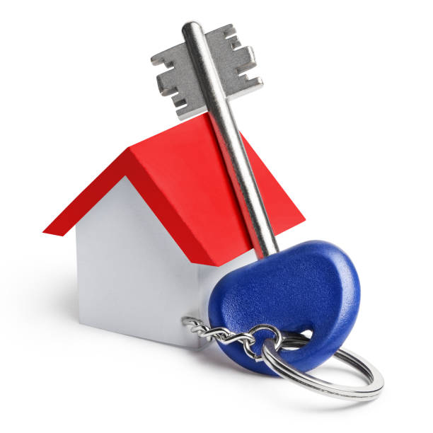 istock House key with a toy house on white 1169320887