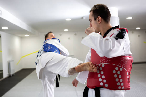 istock Two taekwondo competitors training for a tournament 1169320890