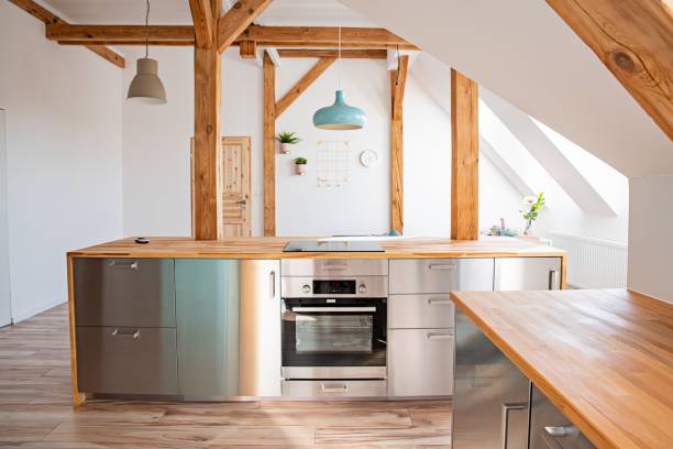 istock Bright attic kitchen in apartment. 1169320949