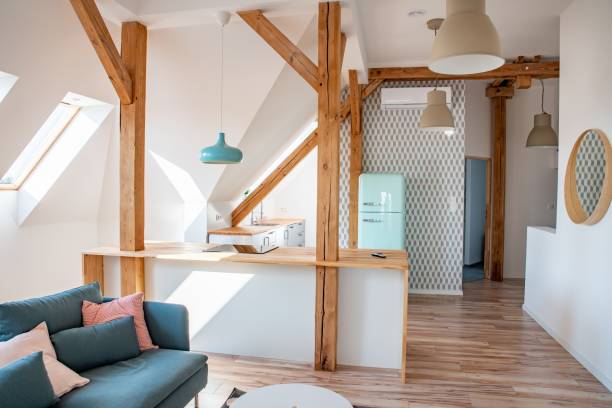 istock Bright attic kitchen in apartment. 1169321726