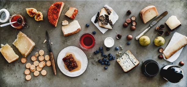 istock Wine and snack variety over grey backgorund, top view 1169321795