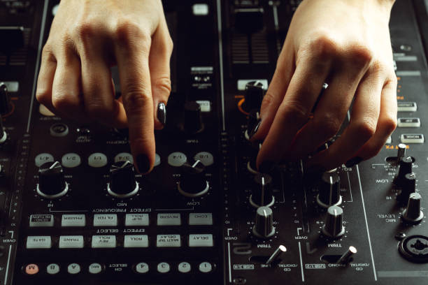 istock DJ playing music at mixer closeup 1169324398