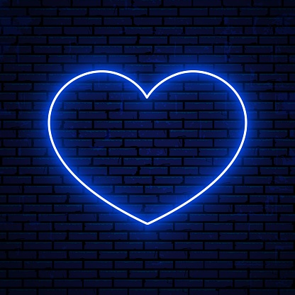 Neon heart sign isolated on brick wall background. Bright neon sign, icon, symbol. Vector glowing heart icon.