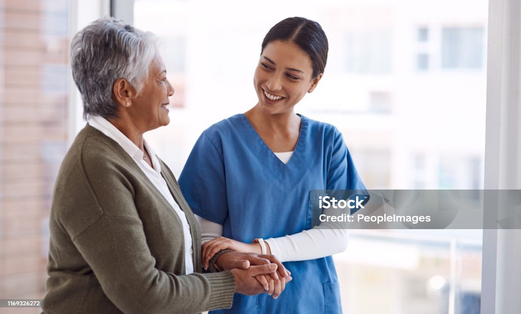 I'll always be here by your side Shot of a young nurse caring for a senior woman Patient Stock Photo