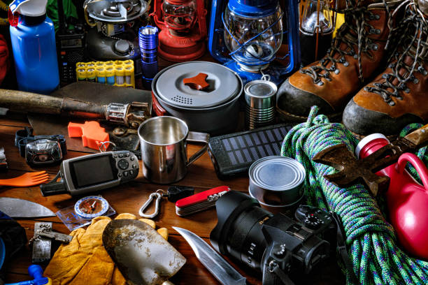 Top view camping and hiking travel and hiking gear, equipment and accessories for mountain trips Camping and hiking themes: Top view of large group of gear, equipment and accessories for mountain trips. survival tools stock pictures, royalty-free photos & images