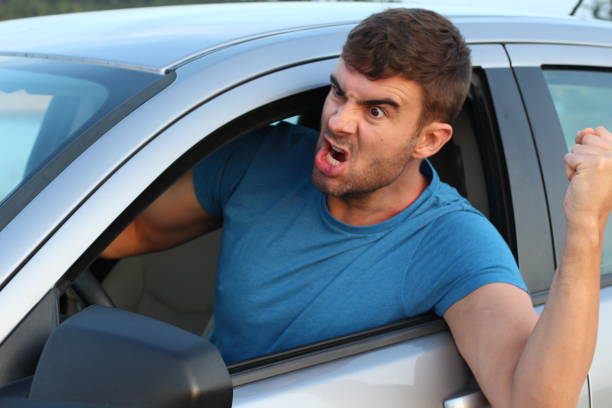 istock Irritated male driver showing violence 1169327875