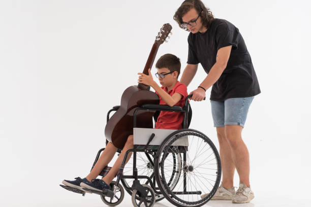 istock Disabled Young Musician with her brother 1169328018