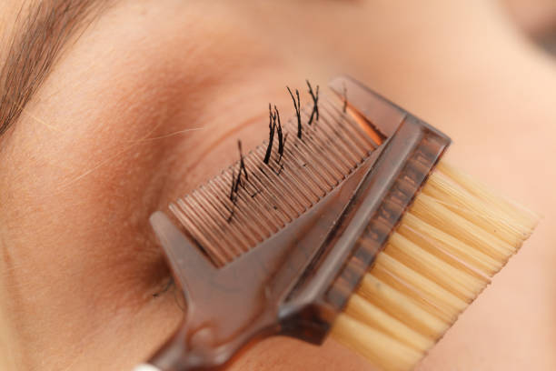 istock Woman brushing her eyelashes 1169329040