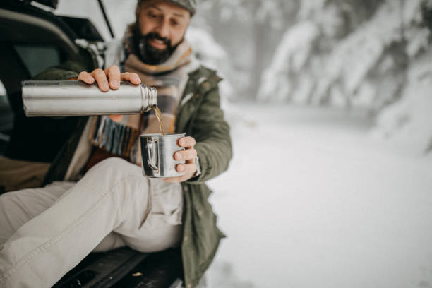 istock Coffee break in snowy forest 1169329481