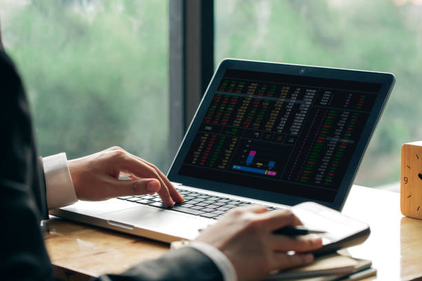 istock Business man or accountant working on laptop computer with business document,and calculator on office table 1169330462