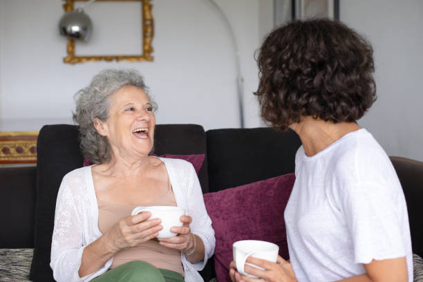 istock Happy mother and daughter drinking tea 1169330712