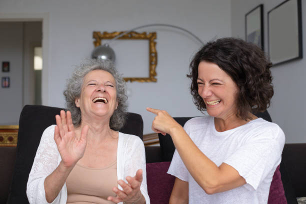 istock Cheerful mother and daughter laughing 1169331133