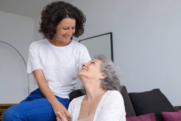 istock Cheerful mother and daughter smiling each other 1169331279
