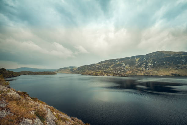 Dark clouds over the hills behind Lough Caragh in County Kerry in Ireland