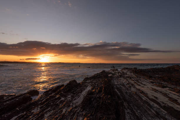 istock Surfers during sunset at Snapper Rocks 1169333759