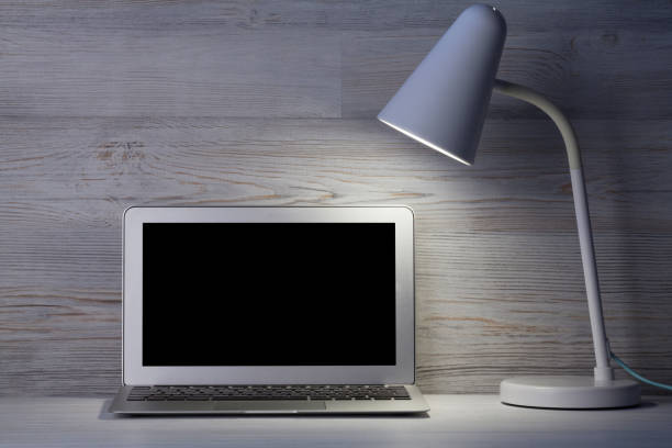 istock Home office workplace with blank screen laptop 1169333784