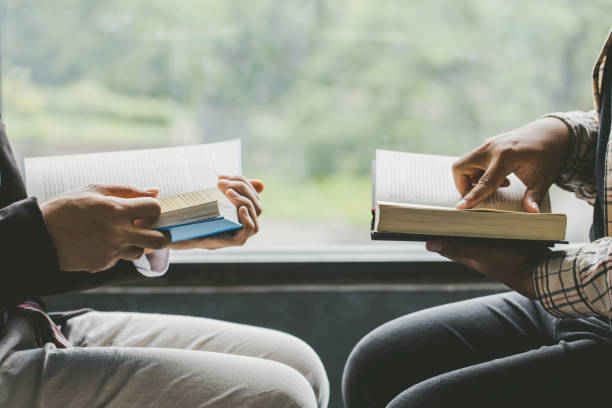 christians and bible study concept.two men studying the bible. - bible holding reading book imagens e fotografias de stock