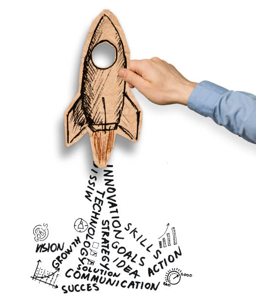 istock hand holding paper rocket with business words as engine smoke 1169342294