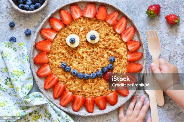 Food For Children Funny Sun With A Smile Pancakes With Berries Stock Photo - Download Image Now