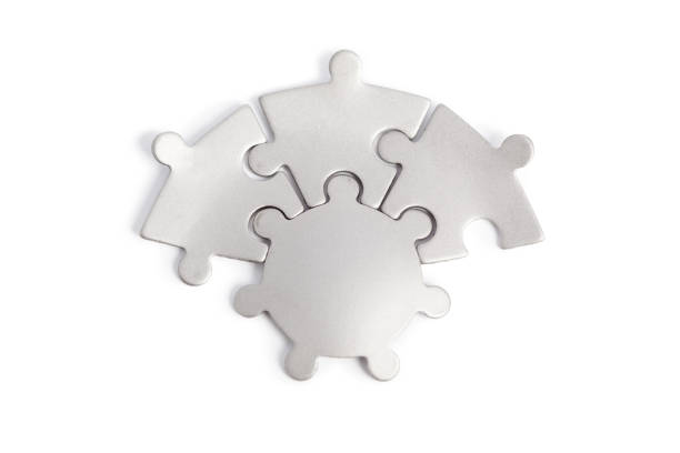 piezas de rompecabezas de metal aisladas en blanco - jigsaw piece puzzle jigsaw puzzle metal fotografías e imágenes de stock