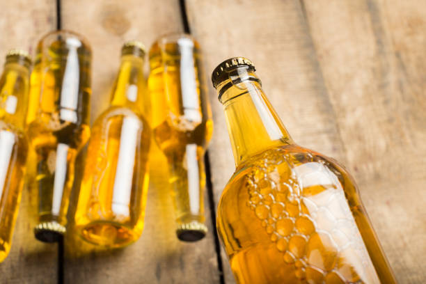 istock Beer bottles on a wooden table . 1169342868
