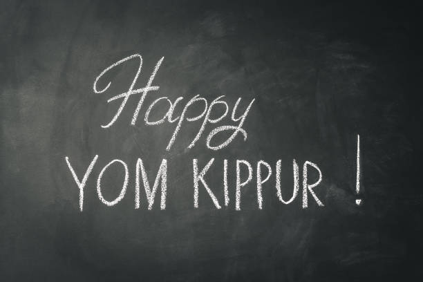 istock Inscription Happy Yom Kippur on chalkboard background. 1169343167