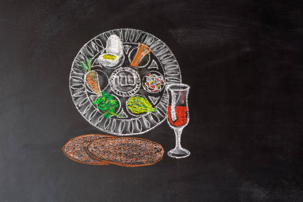 Passover plate and traditional food for Passover (Pesach) on chalkboard. Passover dinner, seder pesach. stock photo