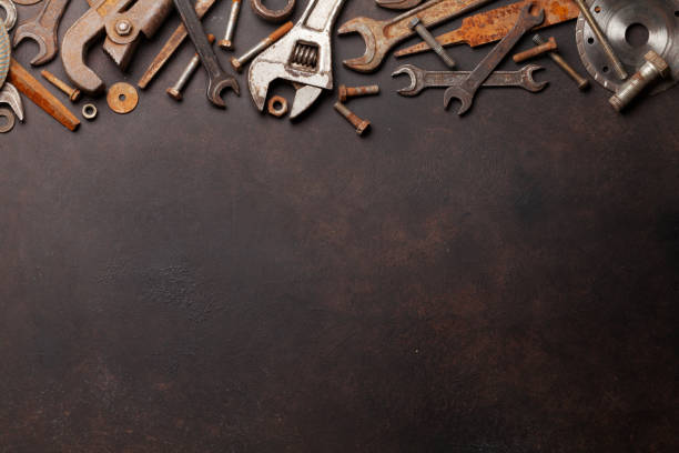 Vintage tools Vintage old tools on stone backdrop. Top view with copy space. Flat lay rust colored stock pictures, royalty-free photos & images