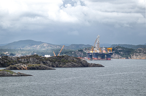 Oil/Gas rig set in the beautiful Norwegian fjord countryside.