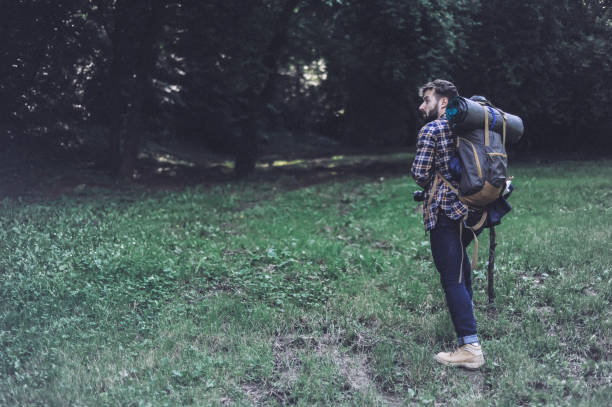 istock Young hiker exploring wild nature 1169349379
