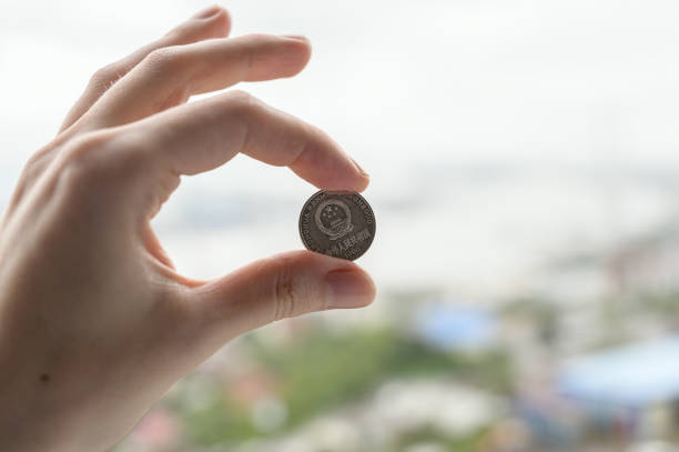 istock Chines money in hand. 1169351720